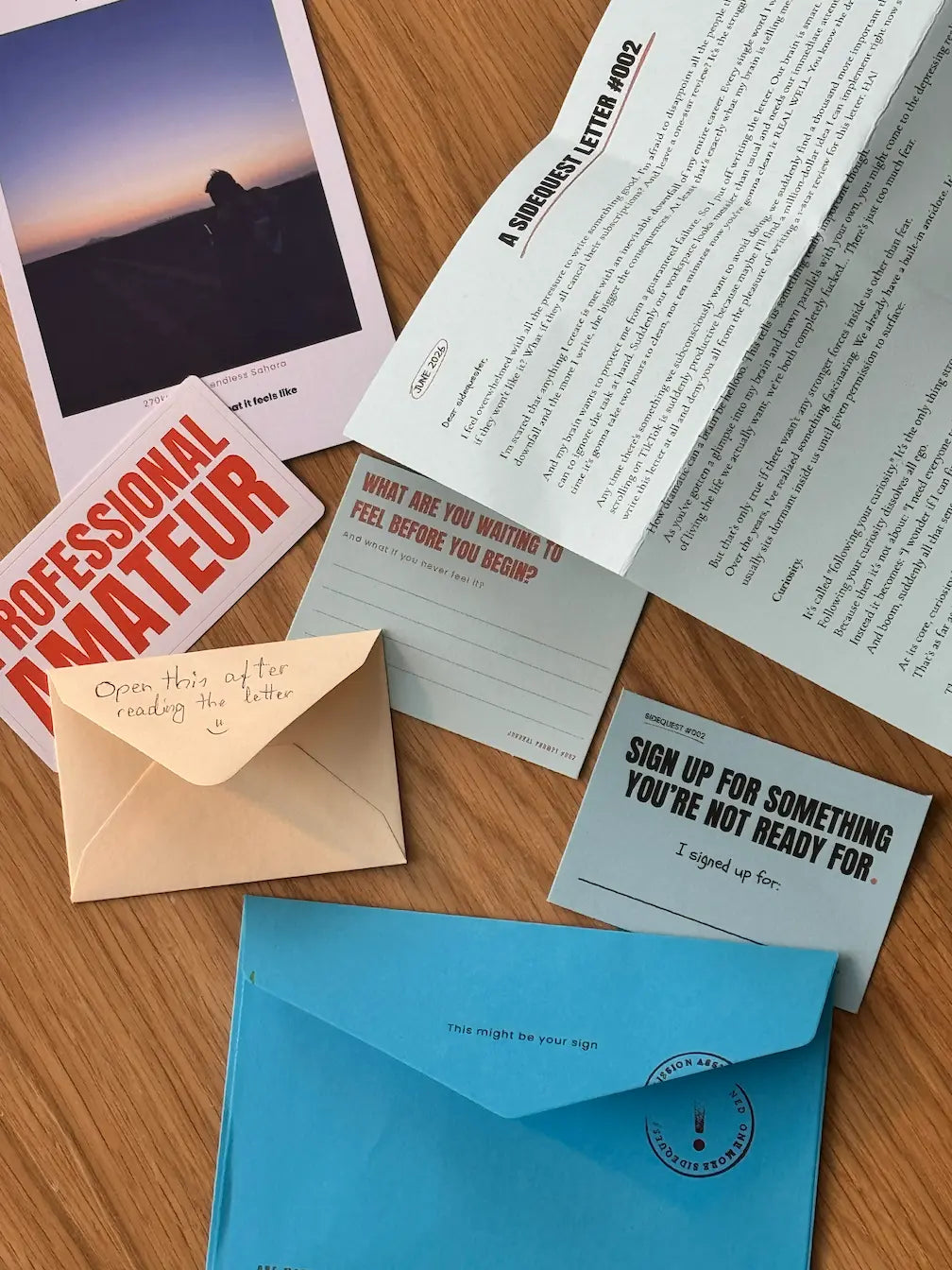 Collection of letters, envelopes, and a photo on a wooden surface